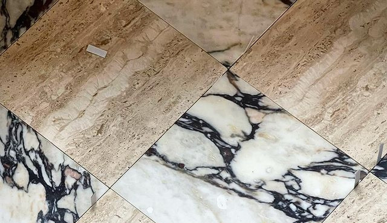 Honed, filled travertine laid in a checkerboard with Viola marble